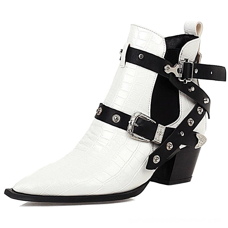 Gothic chunky heel ankle boots featuring rivets and buckle design elements from side profile view