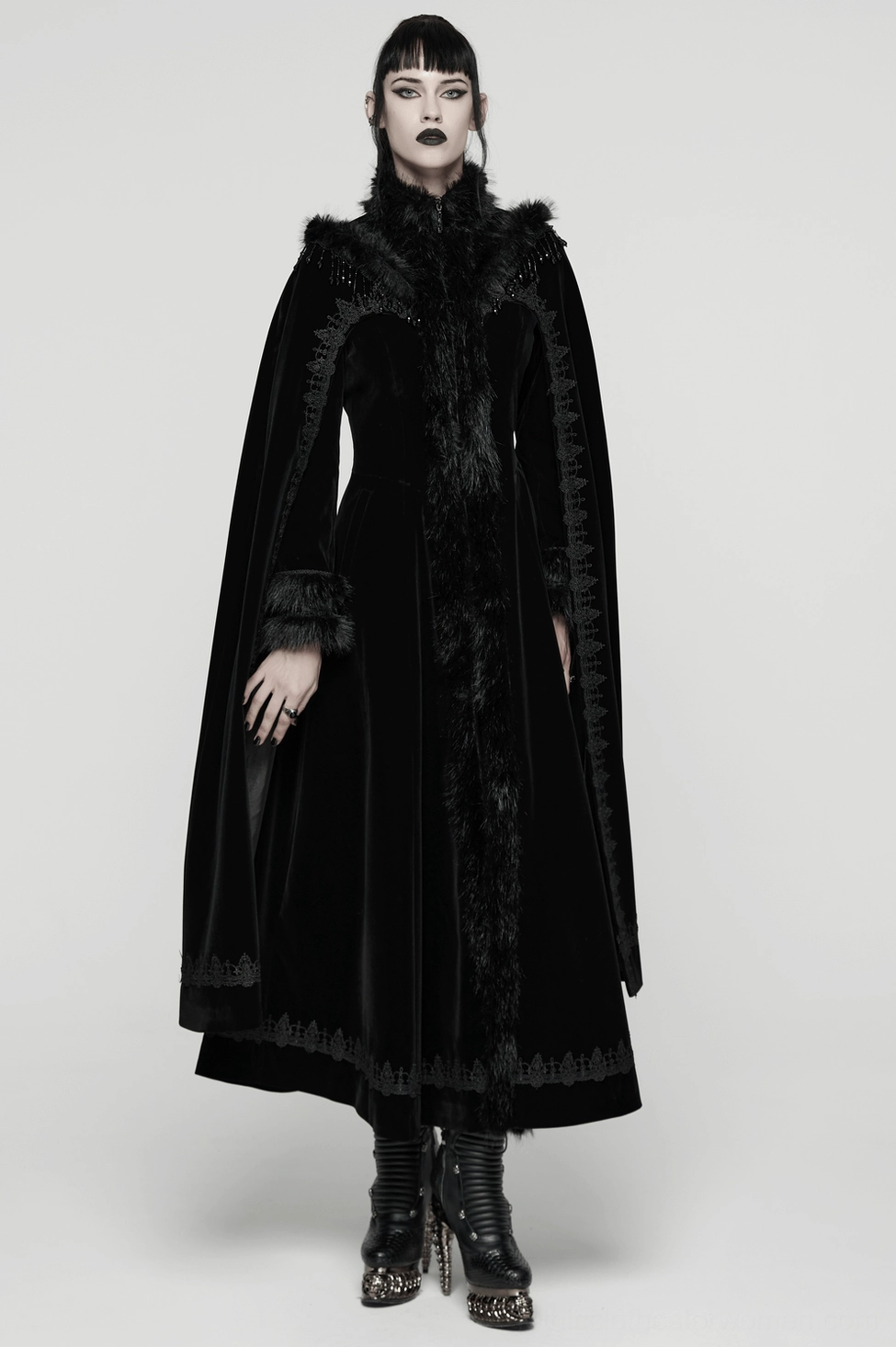 Black gothic cloak coat showing adjustable drawstring waist and practical pocket placement