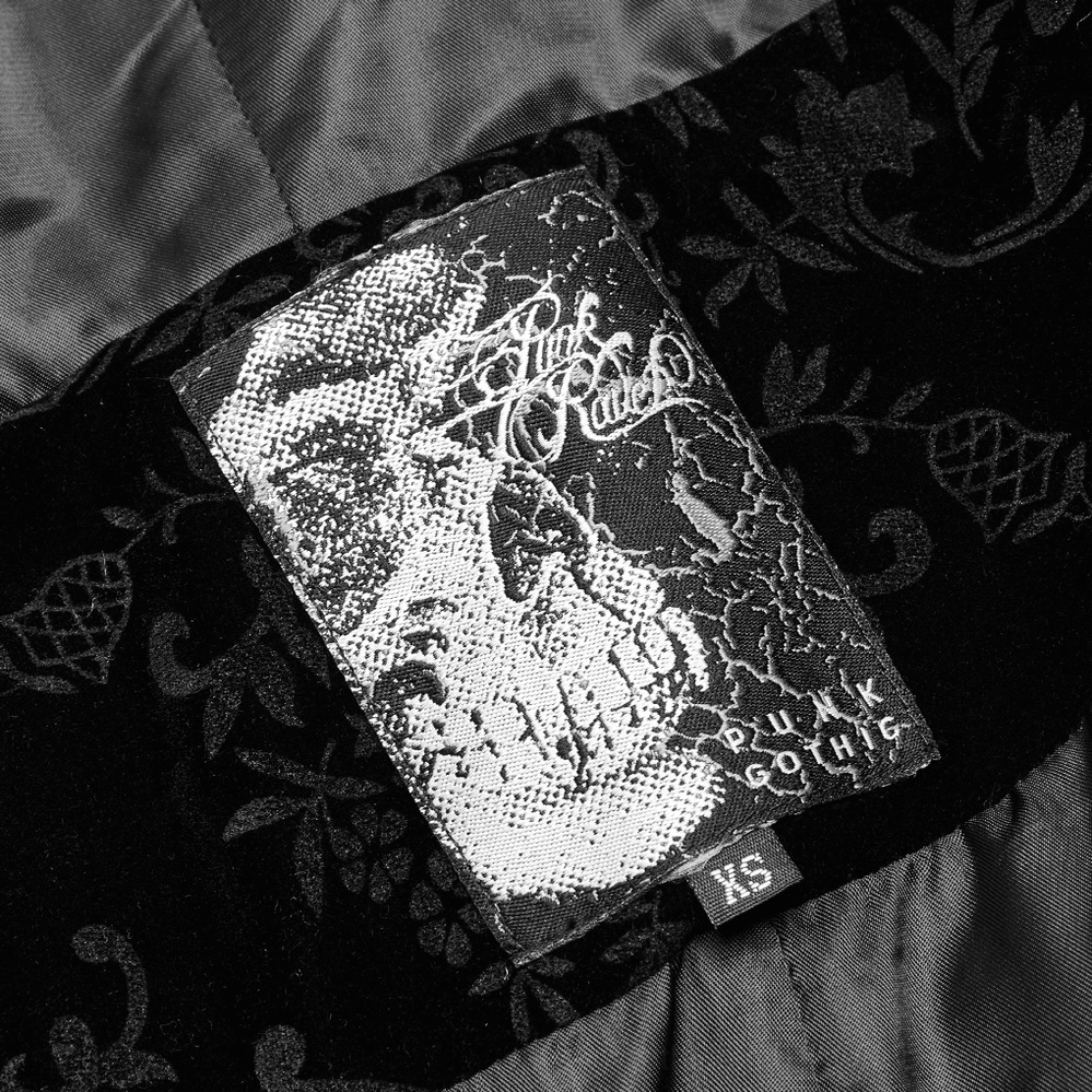 Gothic cloak inner label and satin lining detail showing material composition and brand information