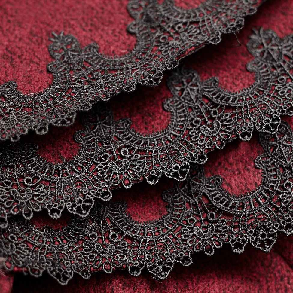 Wine-red gothic cloak showing tie closure mechanism and neckline faux fur framing detail