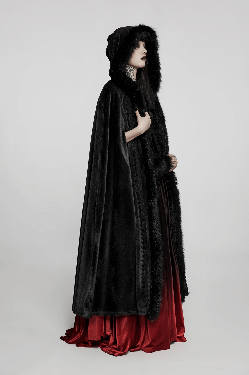 Three-quarter front view of Gothic velvet cloak with faux fur trim and hooded silhouette