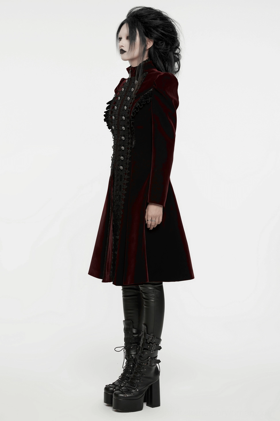 Styled close-up of wine-red gothic coat worn with alternative fashion accessories and styling