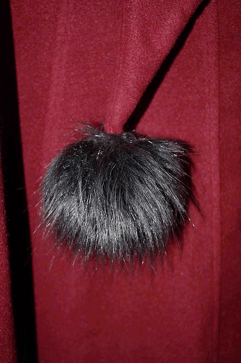 Alternative view of burgundy gothic coat showing full length silhouette and dramatic hem proportion