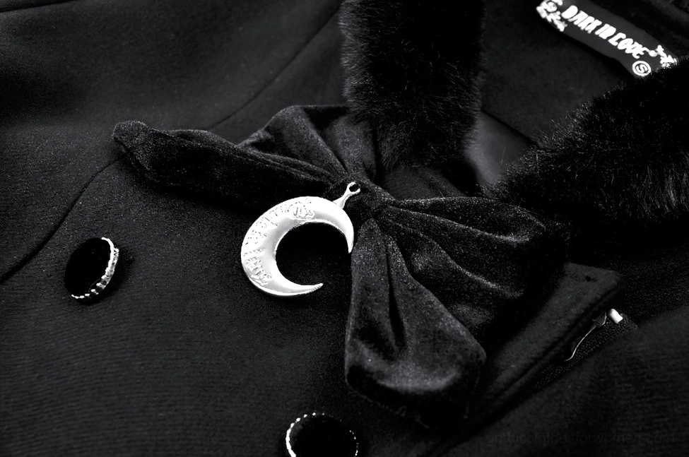 Gothic coat collar detail with velvet bow and crescent moon brooch