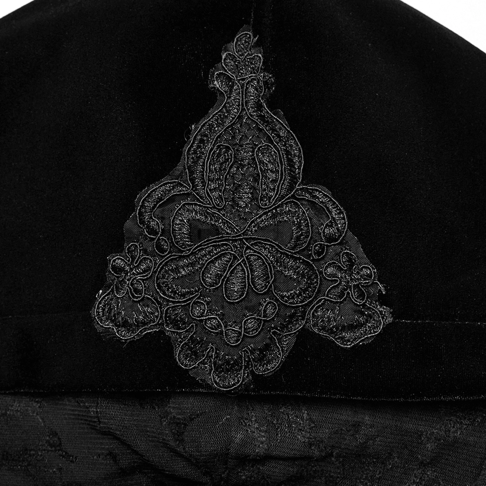 Close-up detail of gothic velvet coat collar with embroidery lace trim and metal zipper