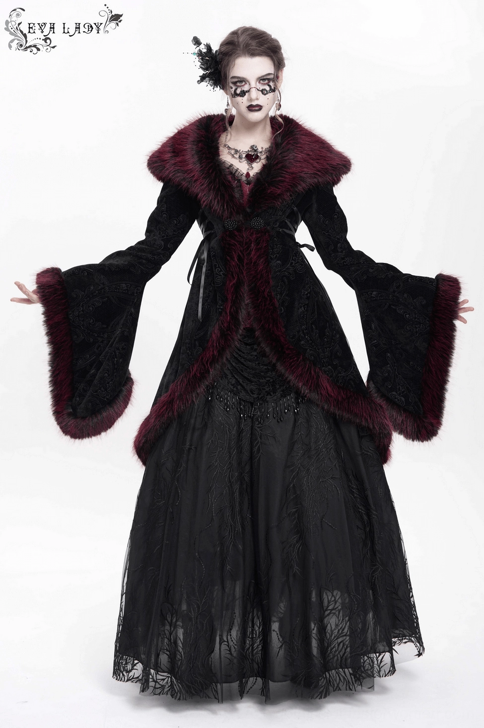 Detail shot of gothic coat showing cuff construction with burgundy faux fur trim, lace embellishment, and sleeve opening detail