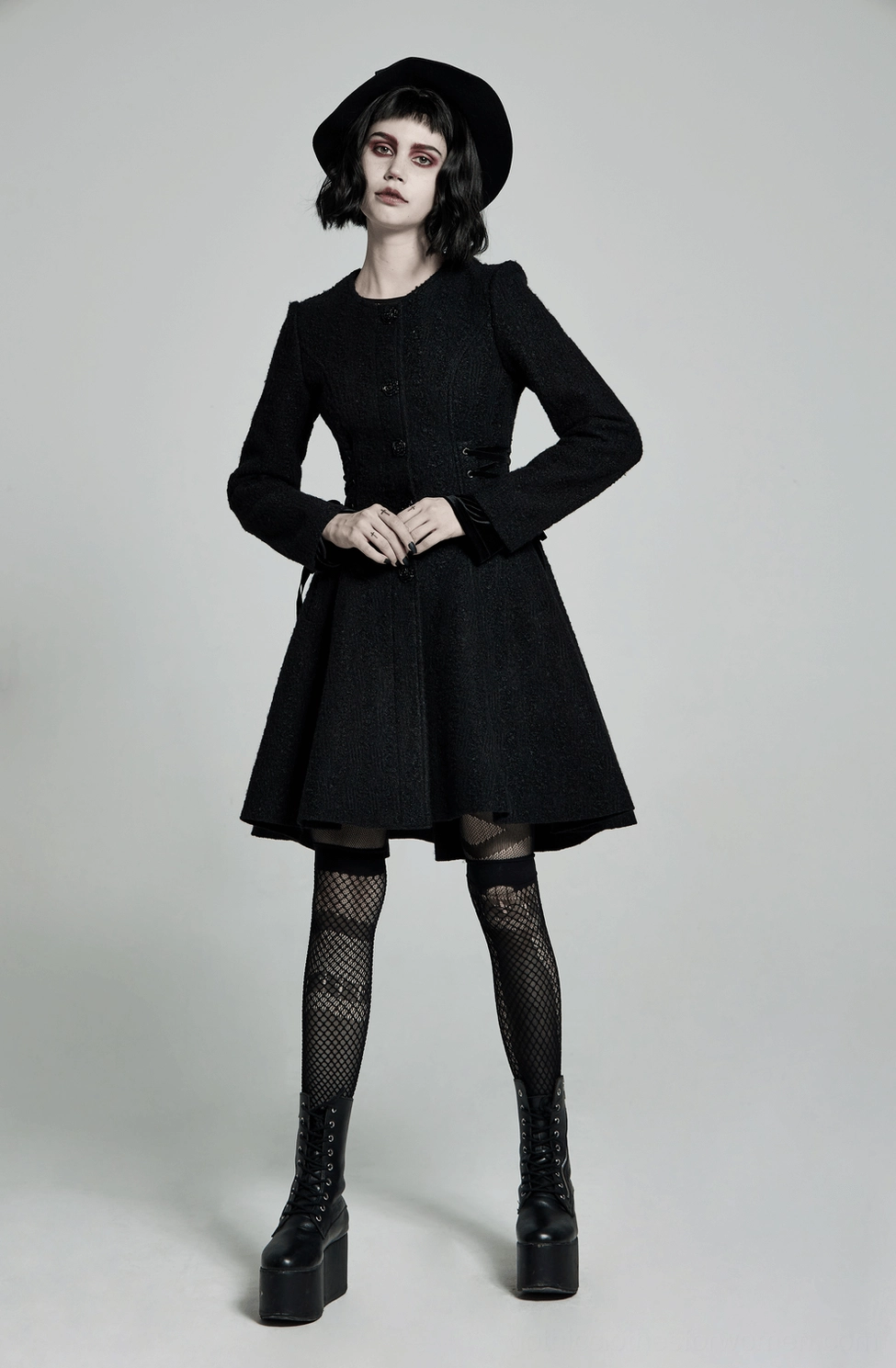 Gothic Victorian coat worn as styling example for dark academia aesthetic