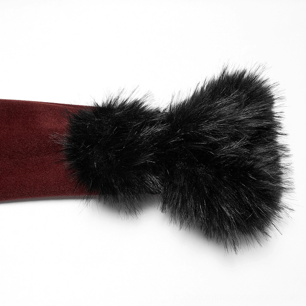 Close-up detail of faux fur cuff showing fluffy black fur texture against wine red suede base with handmade buckle accent