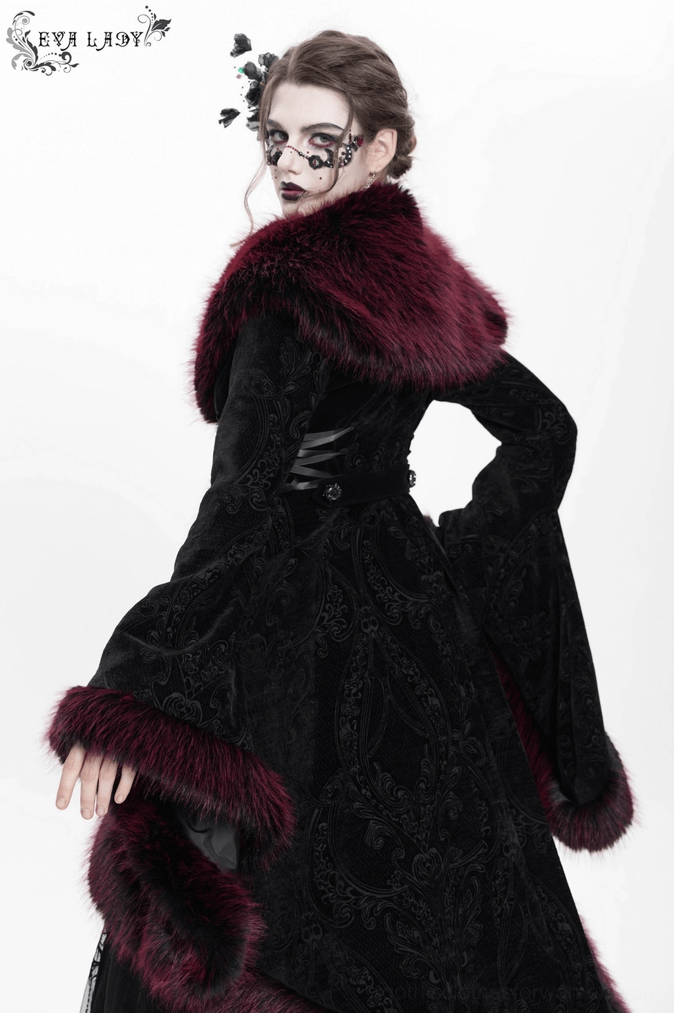 Detailed view of gothic coat front showing decorative beaded closures, jacquard velvet pattern, and burgundy fur collar definition