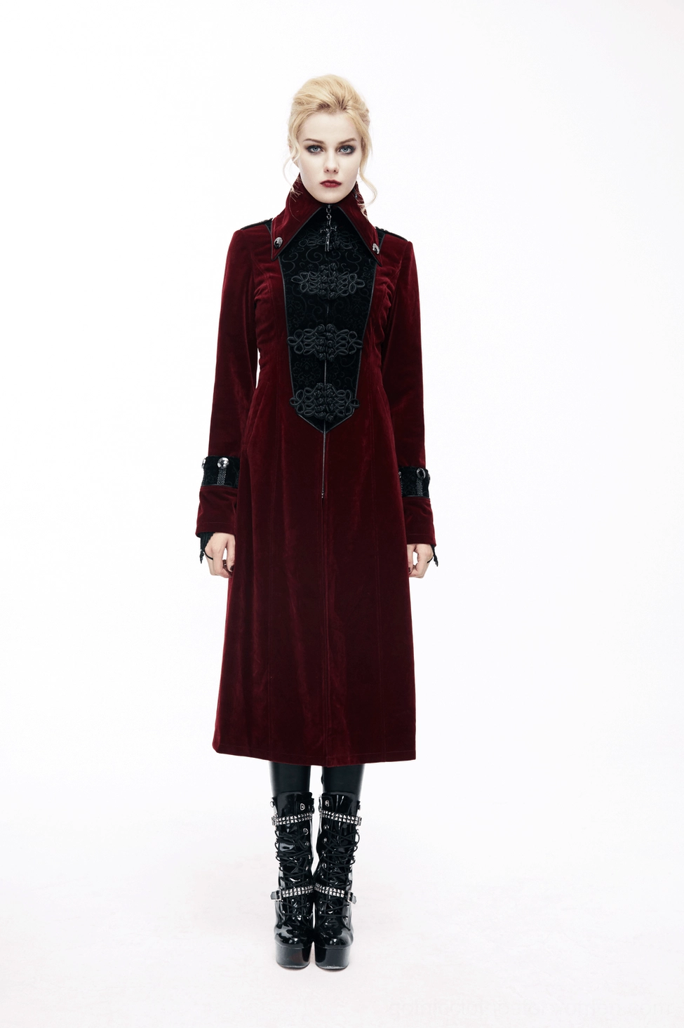 Black embossed gothic coat front panel detail - intricate corded embroidery, velvet texture, gothic artistic craftsmanship on wine red background
