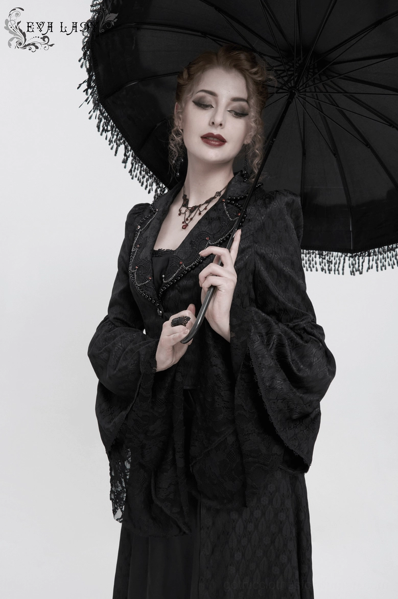 Black gothic coat high front slit detail showing structured hem and tailored opening
