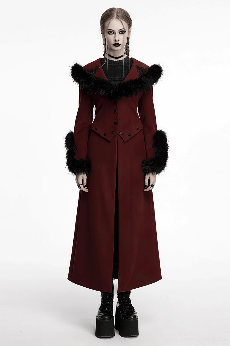Front styling view of gothic coat worn as full-length statement piece with dramatic silhouette and theatrical black fur collar