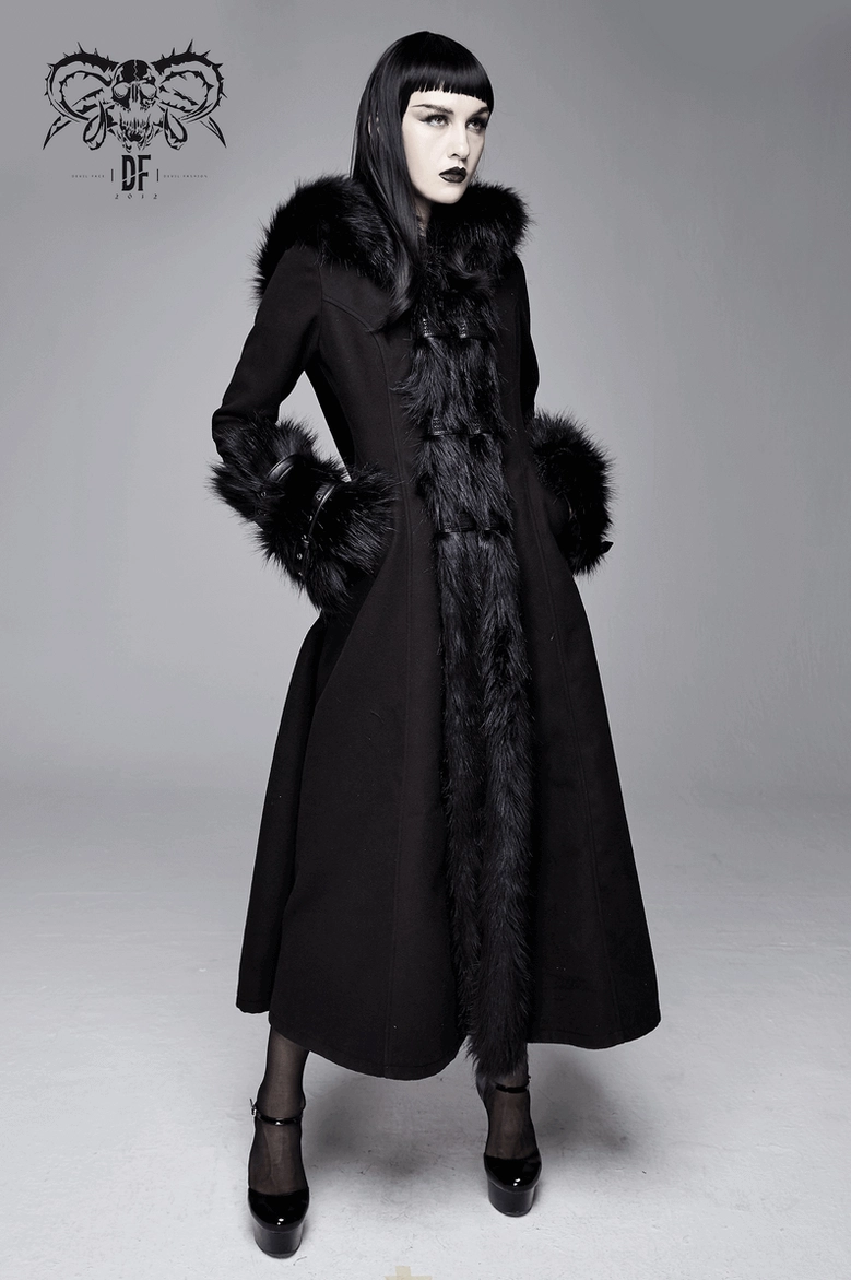 Full-length gothic winter coat displaying theatrical length, structured fit, faux fur trim coordination, and buckle cuff hardware system