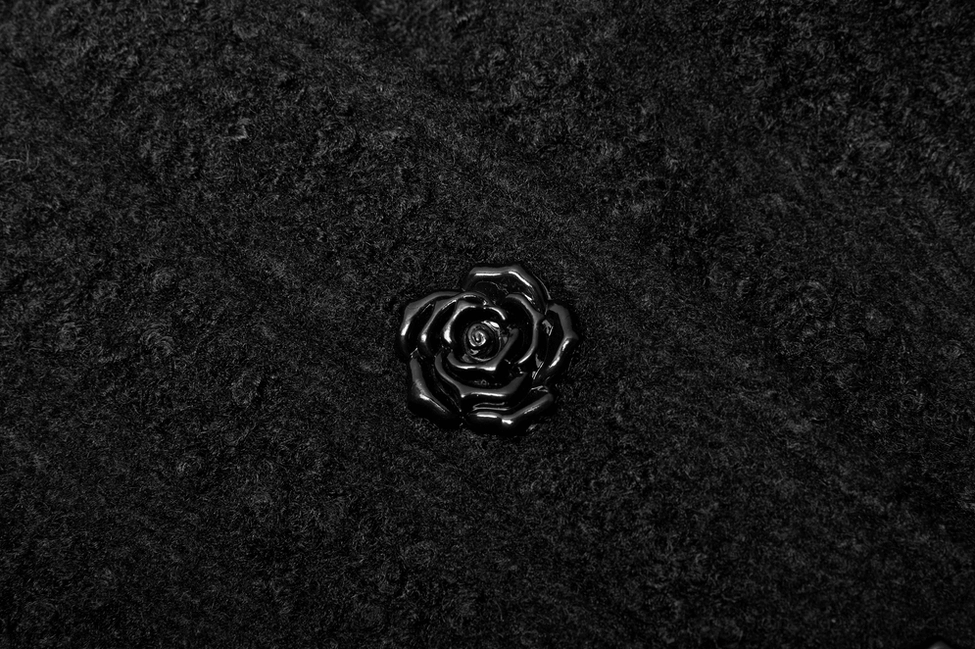 Black Victorian gothic coat detail shot of hand-sewn rose buttons and ornate design
