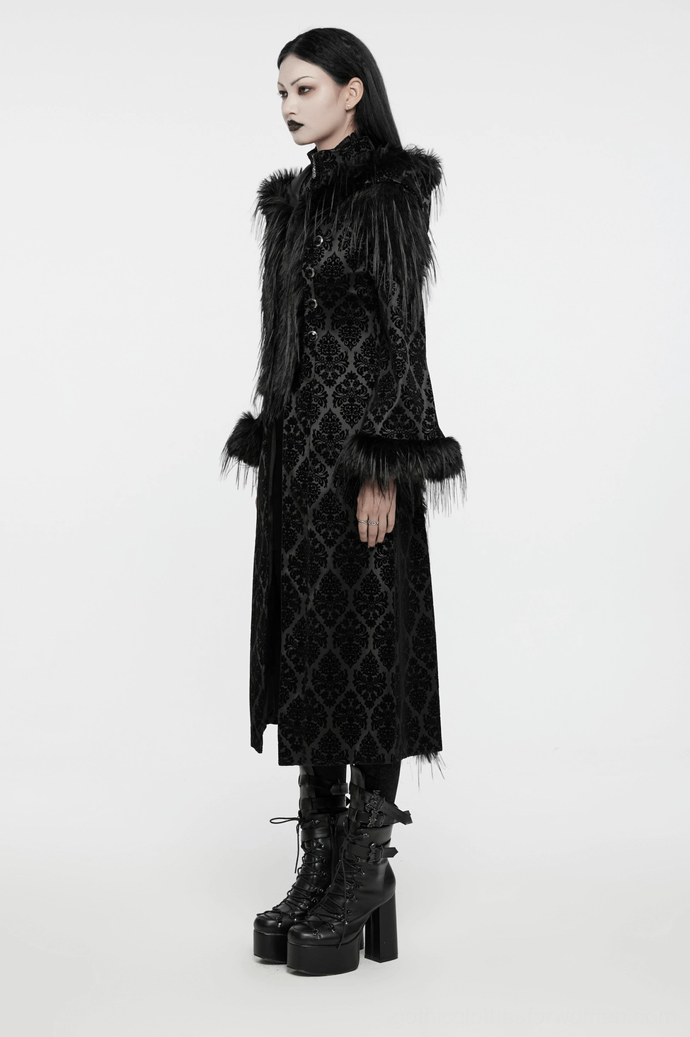 Close-up texture of fluffy faux fur hood trim on black damask jacquard gothic coat