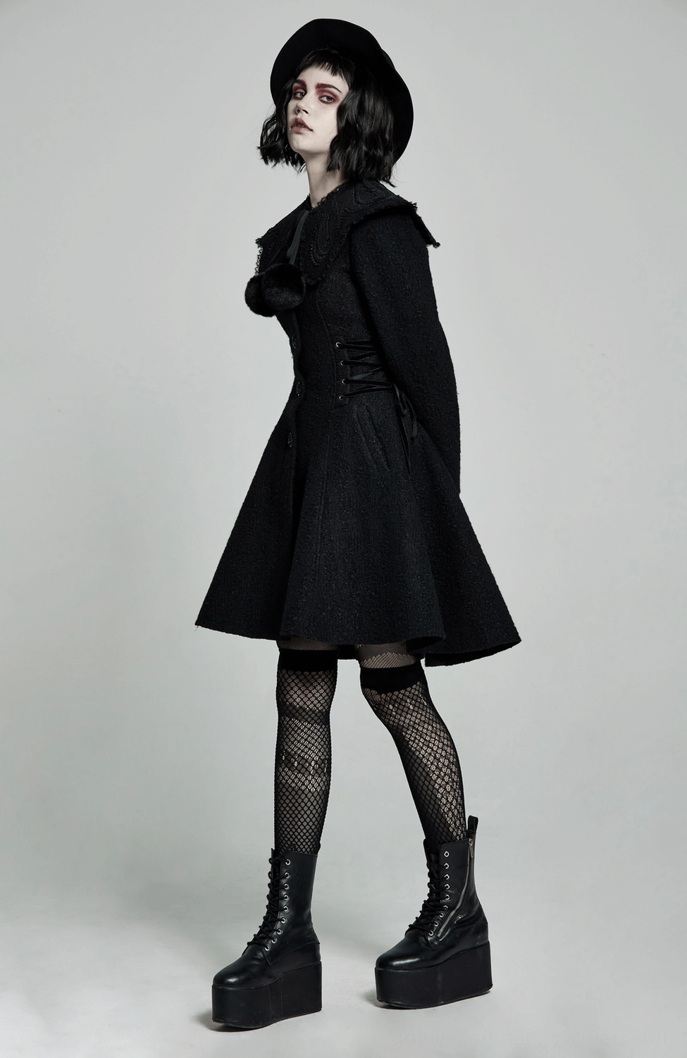 Victorian gothic coat featuring signature lace-up waist and romantic flared silhouette