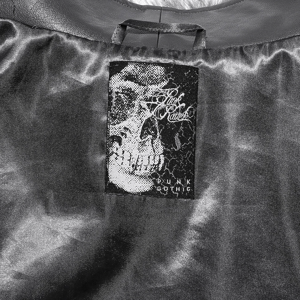 Textured faux fur and leather material combination on asymmetrical gothic coat showing contrast
