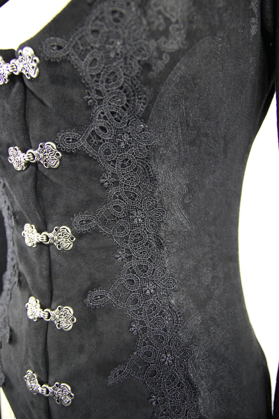 Close-up detail of black gothic coat fasteners showing ornate metal hooks, decorative lace trim, and jacquard fabric texture