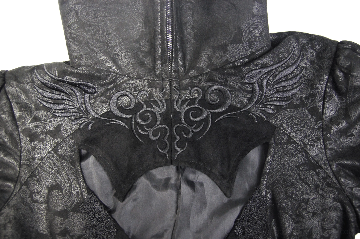 Close-up of gothic coat neckline detail showing bat-shaped cutout, scroll embroidery motifs, and zip collar mechanism