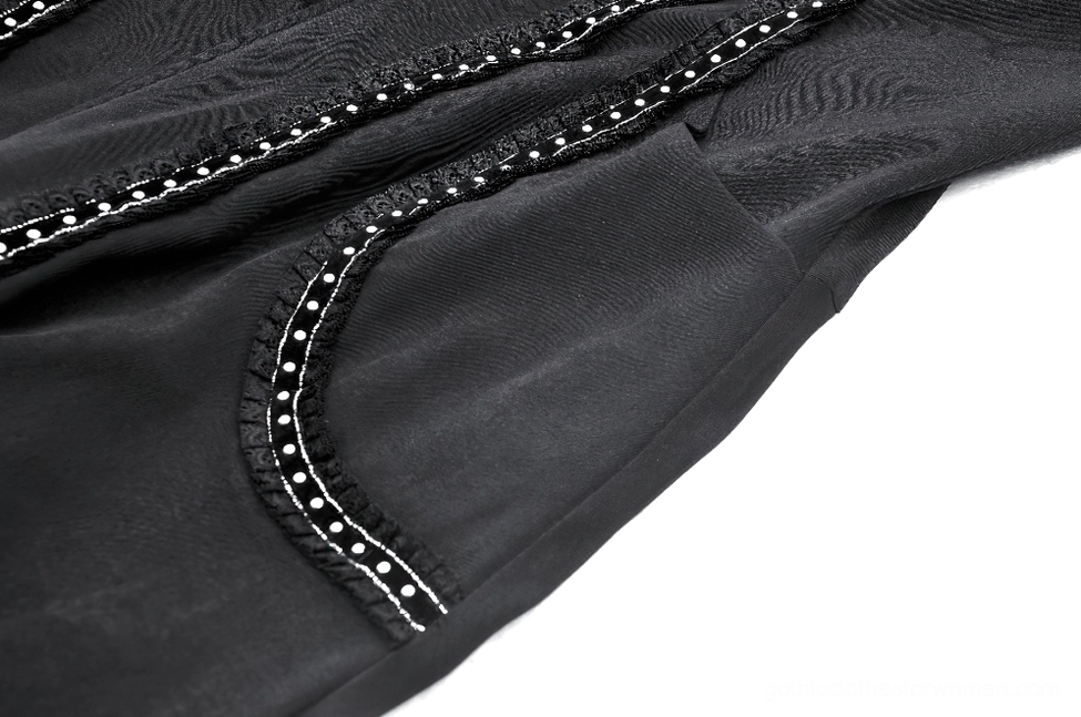 Patch pocket detail of gothic hooded coat with decorative lace trim and matte black finish