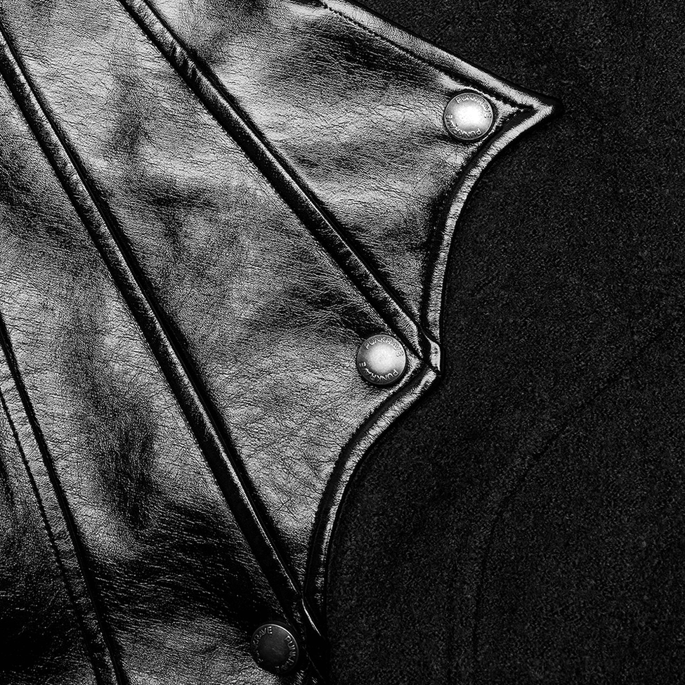 Close-up of asymmetric patchwork stitching showing wool and PU blend with metal snap button details