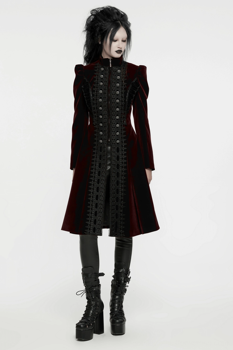 Detail shot of gothic coat's pointed front symmetrical design and lace panel construction