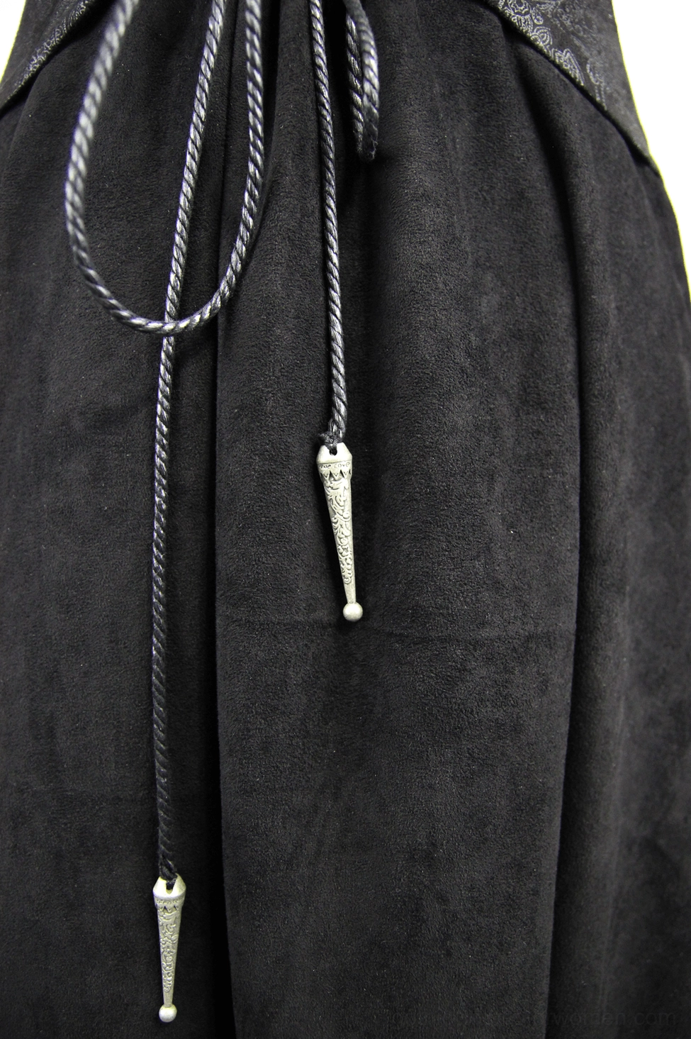 Gothic long coat side detail showing lace panel, metal fasteners, embossed jacquard patterns, and structured high collar design