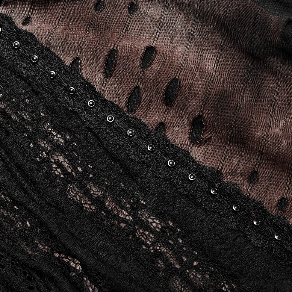 Close-up of gothic coat side trim detail showing black lace overlay and round metal rivets on distressed fabric