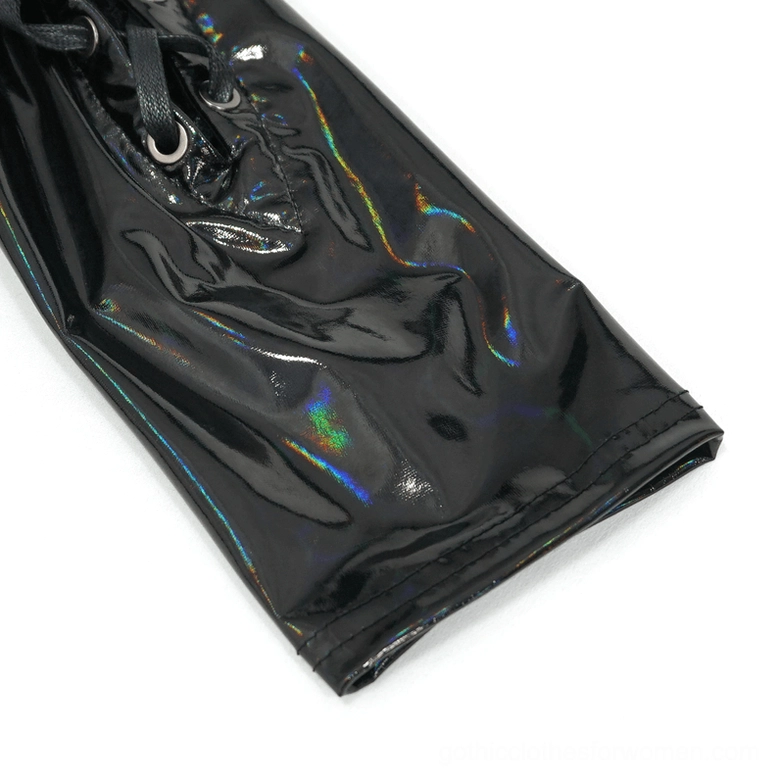 Close-up detail of gothic coat sleeve showing patent leather texture and lace grommet fasteners on mesh panel