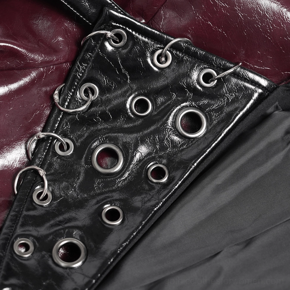 Detail shot of burgundy gothic harness coat sleeve hardware showing metal eyelets, lace strap embellishments, and silver fixtures