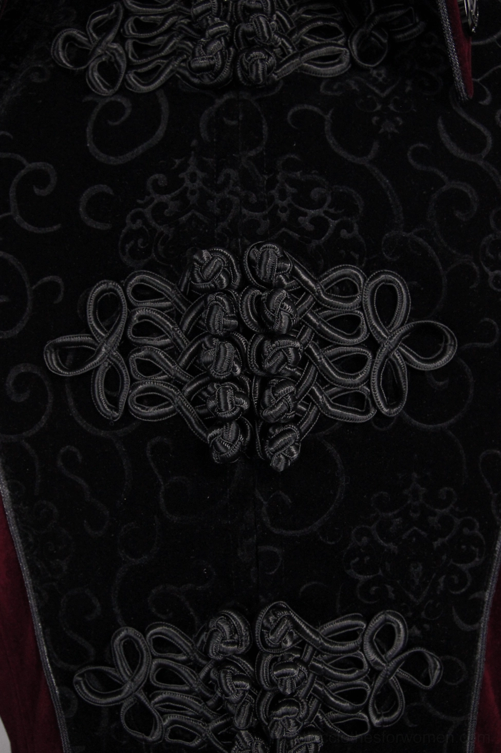 Gothic embossed velvet coat sleeve and cuff styling detail - showing long fitted sleeves with decorative buckle hardware and tailored proportions