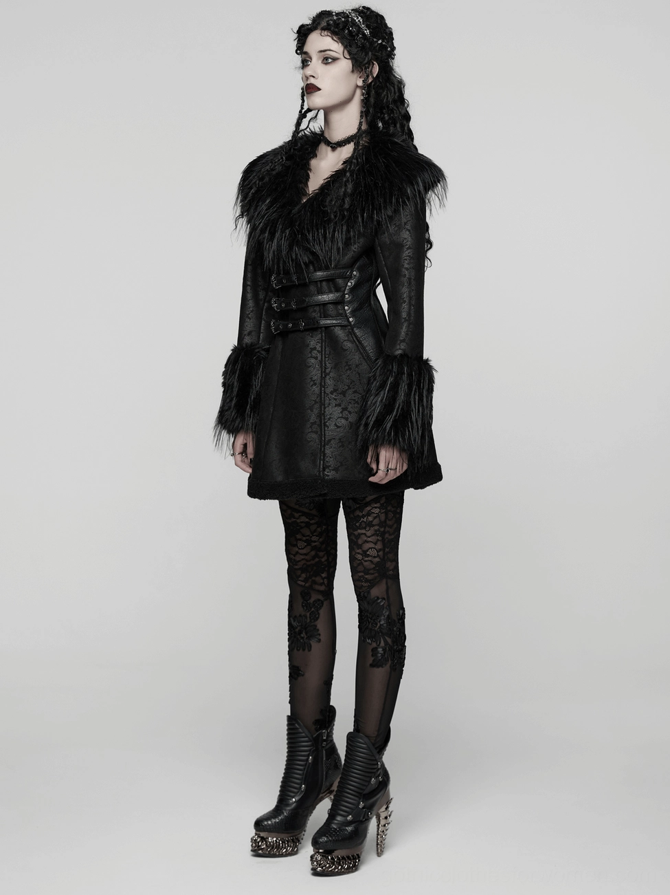 Black gothic coat layering and texture demonstration with plush fur cuffs, structured jacquard body, and corset-inspired back design
