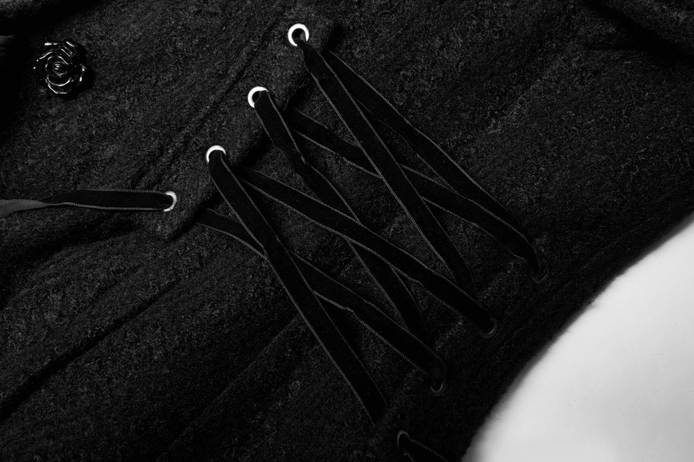 Gothic wool coat detail showing wavy jacquard fabric texture and premium material quality