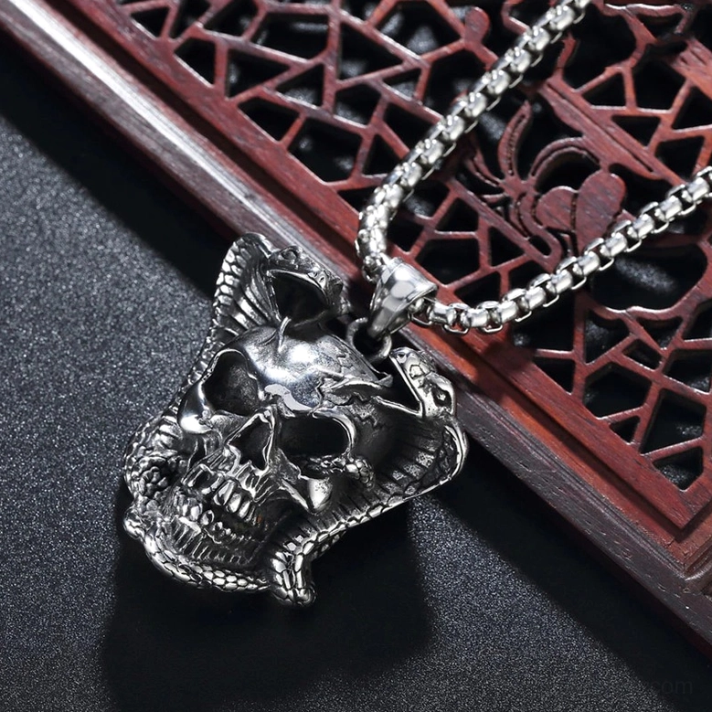 Gothic cobra skull pendant artistic display - skull jewelry emphasizing memento mori symbolism