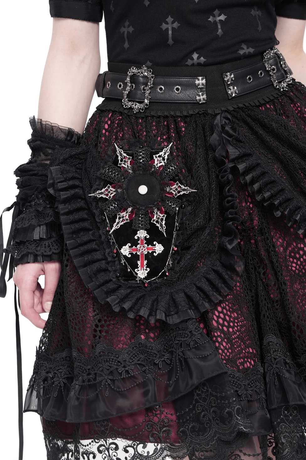 Gothic coffin cross brooch with lace trim worn on black alternative fashion outfit, showing pentagram cross detail and ruffled lace border on female model
