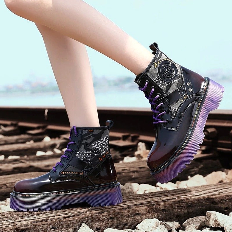 Alternative fashion styling of black gothic combat boots with purple platform, worn with dark clothing