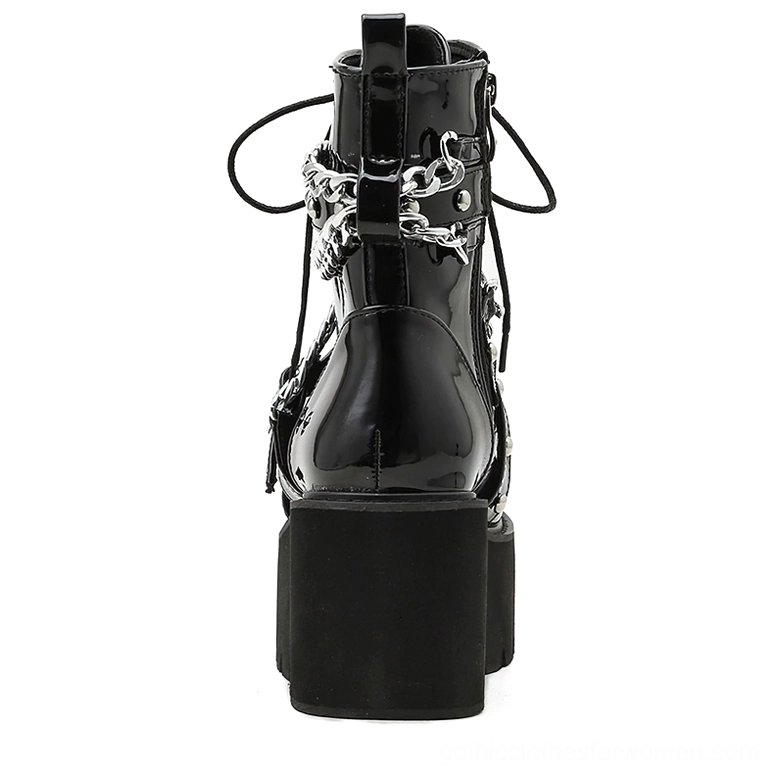 Gothic platform ankle boots rear view displaying side zipper closure and metal hardware on chunky block heel
