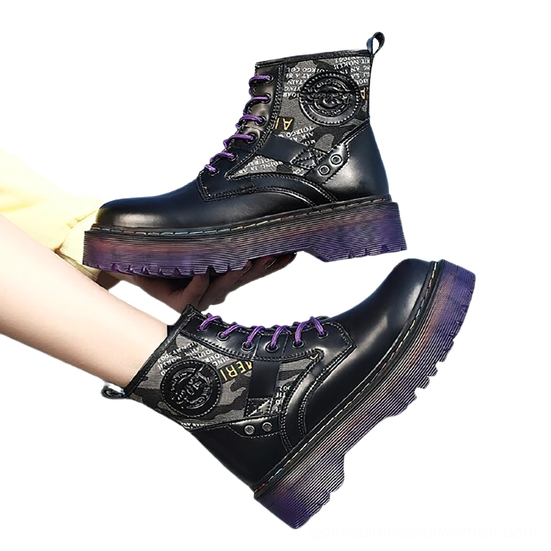 Pair of gothic combat boots in multiple colors with purple platform soles, overhead view held in hands