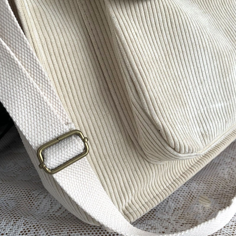 Gothic corduroy tote bag with model styling demonstration, showing real-world carry and fit for dark aesthetic alternative fashion