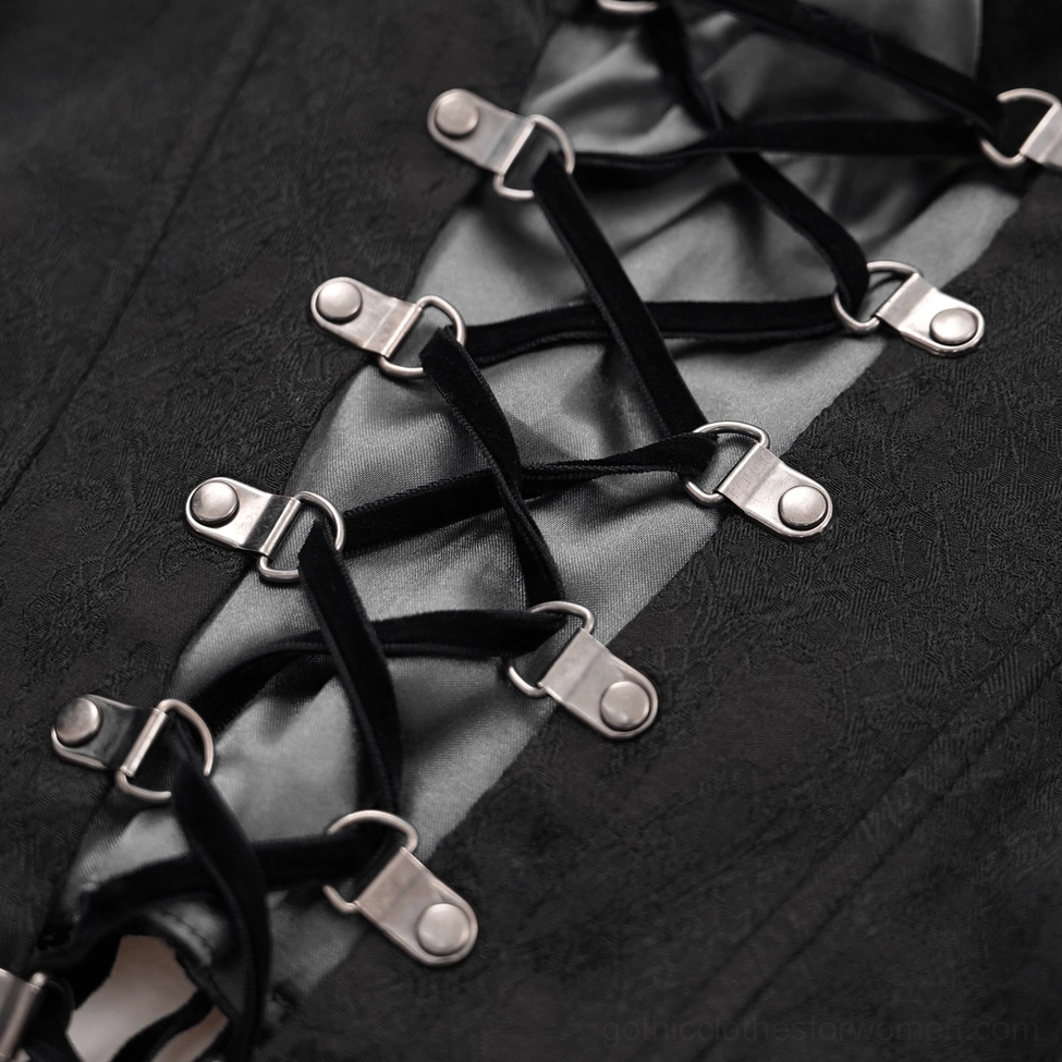 Detailed close-up of back metal buckle fasteners and black velvet laces with matte texture