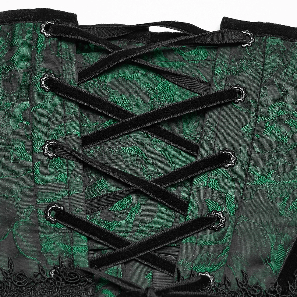 Close-up of emerald jacquard gothic corset back lace-up detail showing black velvet ribbon lacing and green floral jacquard fabric texture