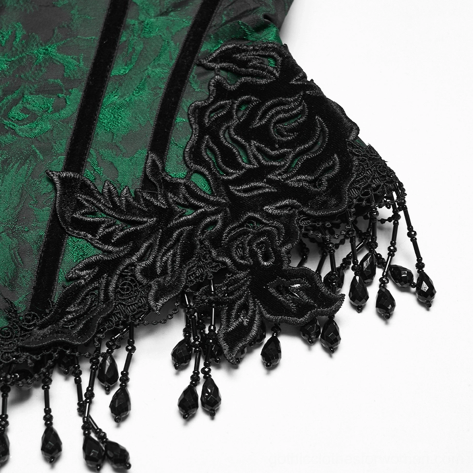 Side detail close-up of emerald gothic underbust corset showing black rose embroidery and hand-beaded tassel trim craftsmanship