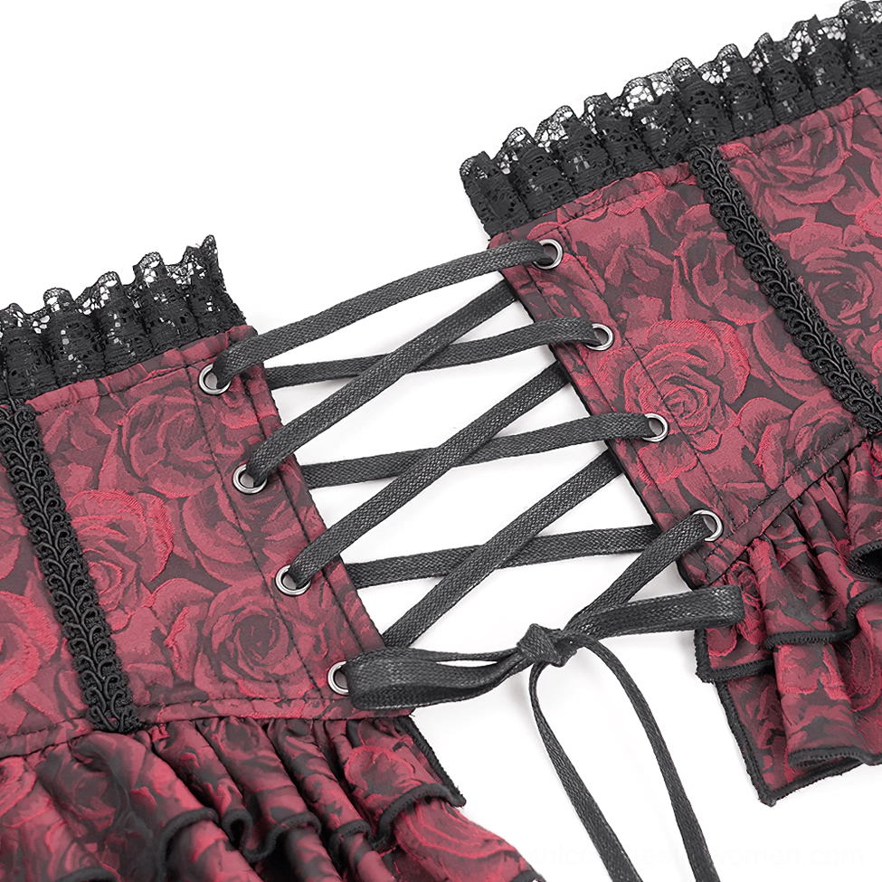 Back close-up detail of gothic corset belt showing crisscross lace straps and metal eyelets with rose brocade