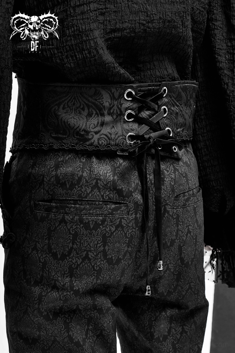 Back waist close-up of gothic corset belt with lace-up closure and embossed brocade texture
