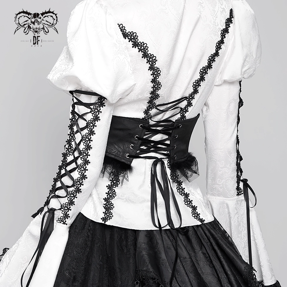 Black gothic corset waist belt close-up product detail shot emphasizing cross embroidery craftsmanship, lace quality, and silver embellishment design