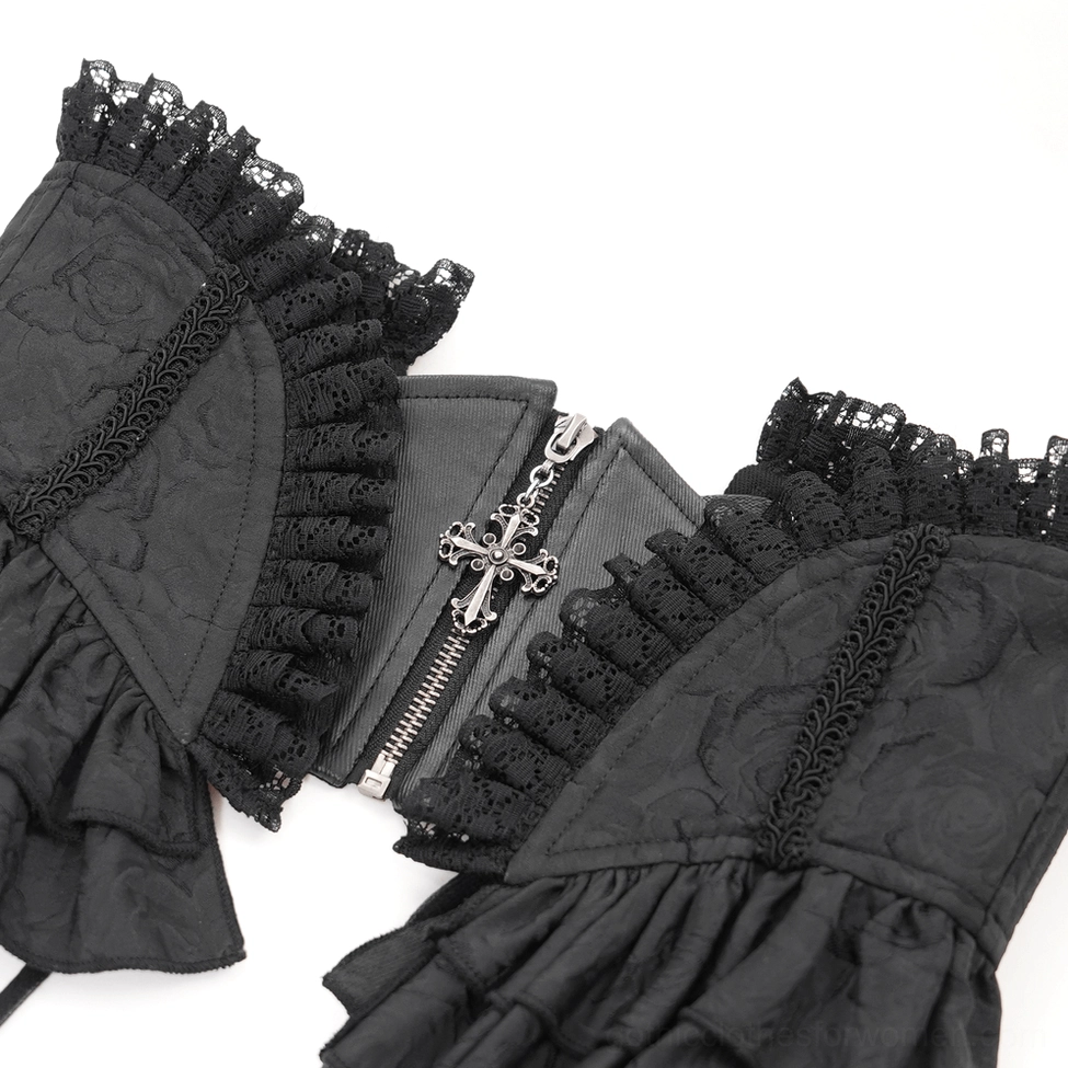Close-up detail of gothic corset belt showing cross charm zipper and intricate ruffled lace trim