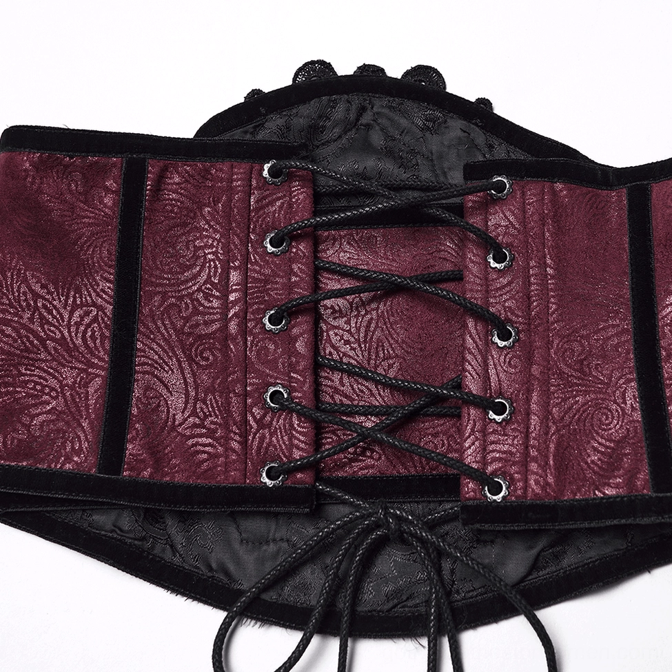 Close-up rear detail of gothic corset belt showing black drawstring and metal eyelet holes with velvet edge trim