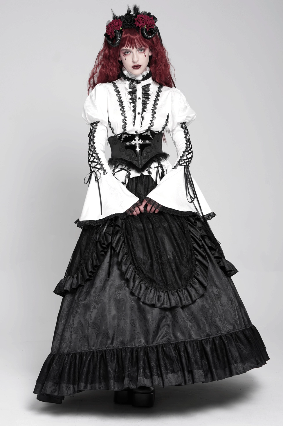 Gothic corset belt worn as part of complete alternative fashion ensemble, showing how piece layers with other items for cohesive dark romantic look