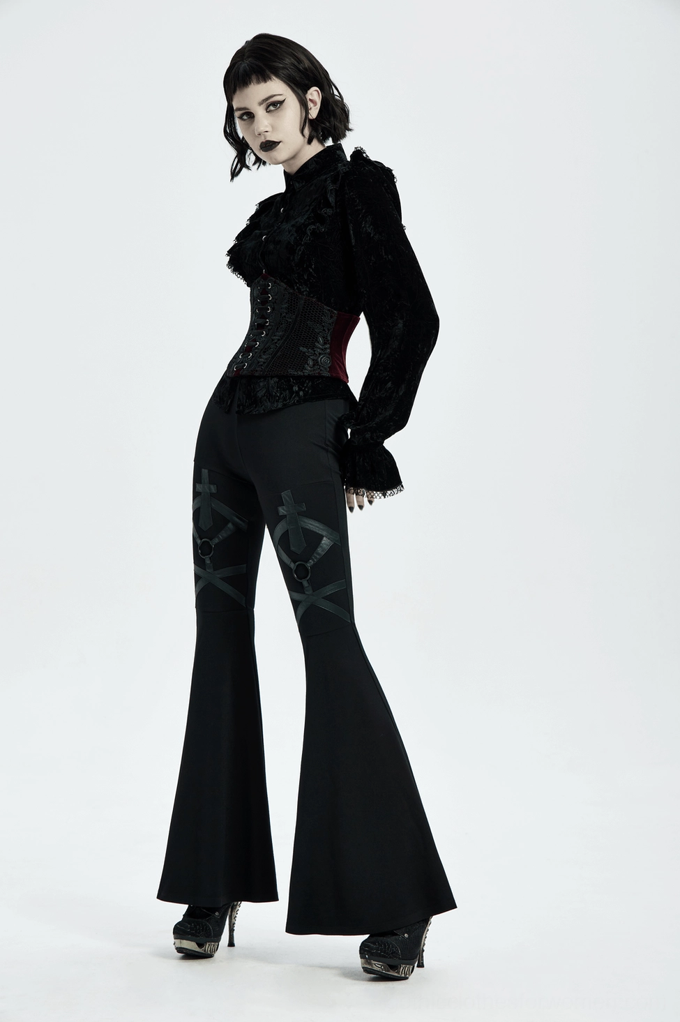 Full-body view of wine red velvet gothic corset belt worn over dark clothing