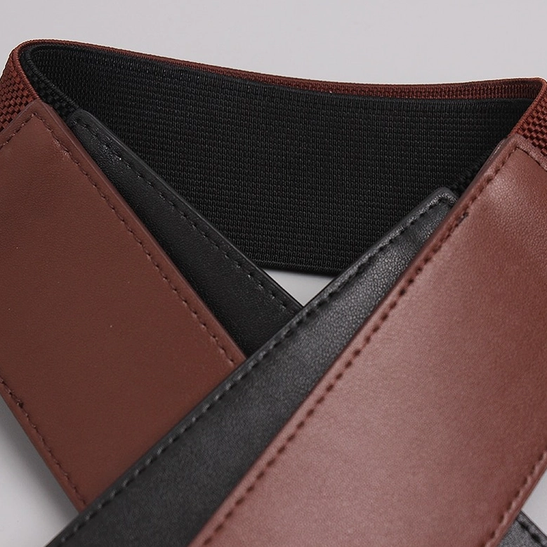 Gothic corset belt interior structure showing elastic fabric layer and leather construction